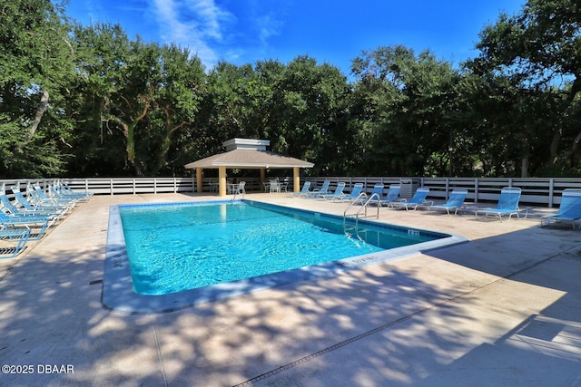 view of swimming pool with a gazebo and a patio