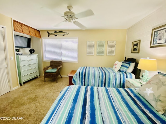 bedroom featuring carpet flooring, ceiling fan, and a closet