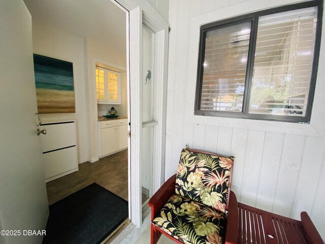 hallway with hardwood / wood-style floors