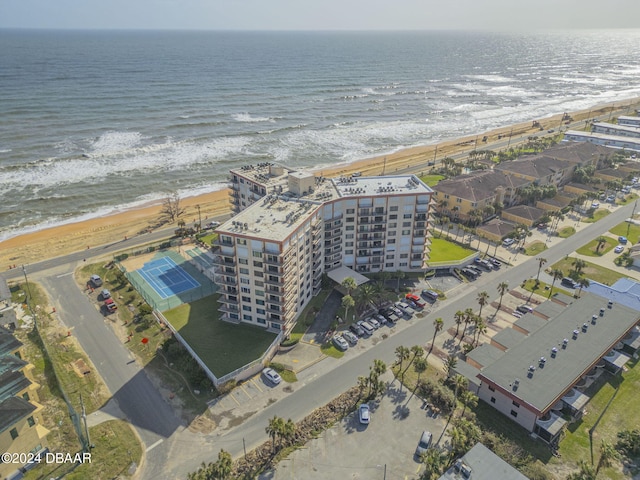 aerial view featuring a view of the beach and a water view