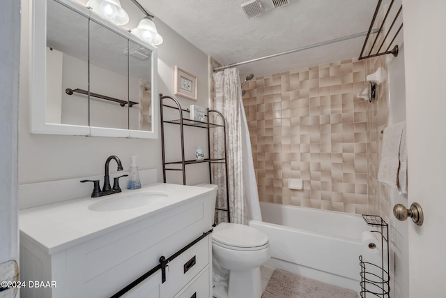 full bathroom with vanity, shower / tub combo, and toilet