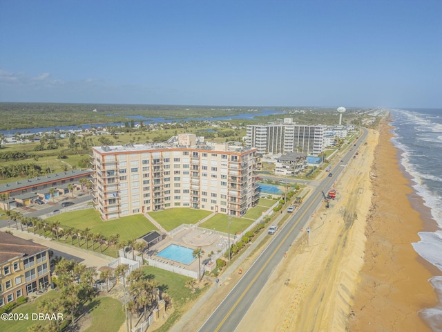 drone / aerial view with a water view and a view of the beach