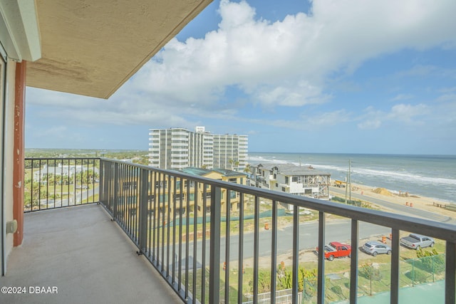 balcony with a view of the beach and a water view