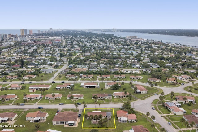 133 Cardinal Dr, Ormond Beach, FL 32176 - aerial view of property's location featuring property parcel outlined, a large body of water, and nearby urban area