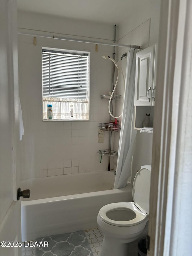 bathroom with tile patterned flooring, toilet, and shower / tub combo with curtain