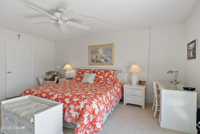 bedroom featuring ceiling fan and light carpet