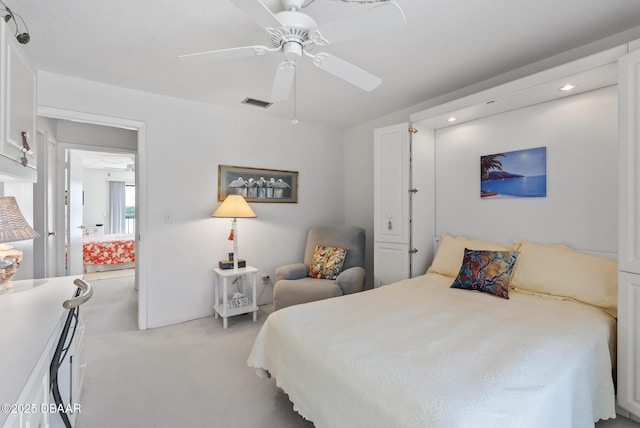 carpeted bedroom with ceiling fan