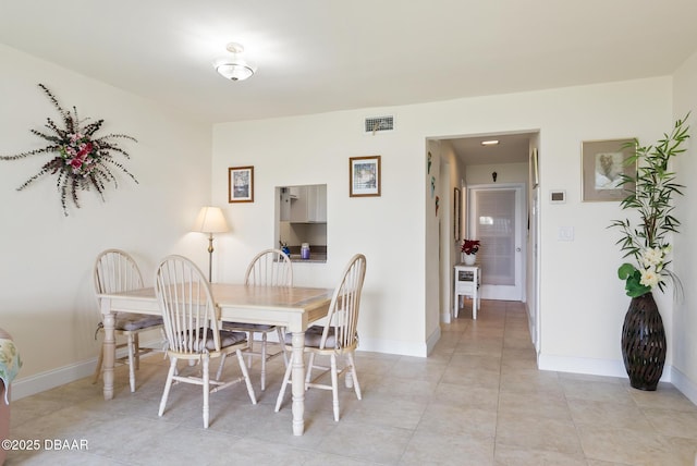 view of tiled dining space