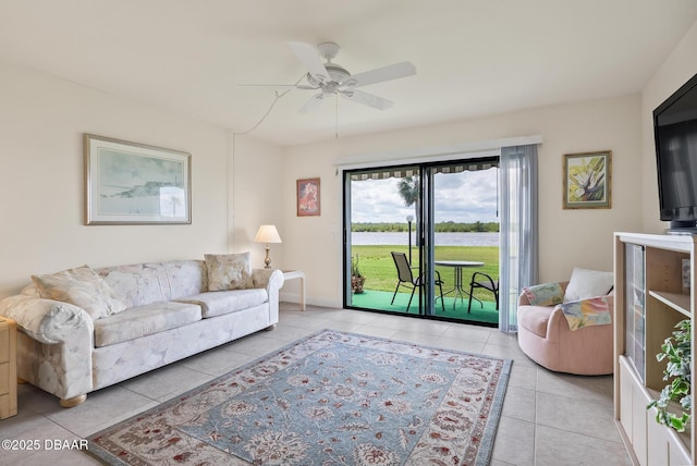 living room with ceiling fan and light tile patterned flooring