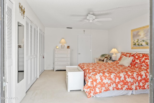 bedroom with light colored carpet and ceiling fan