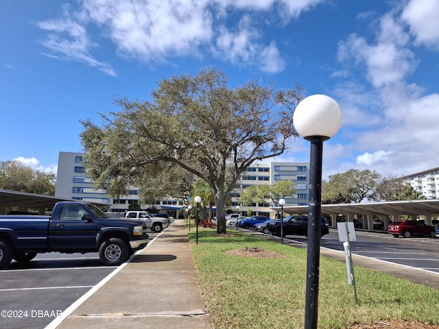 view of parking featuring a carport