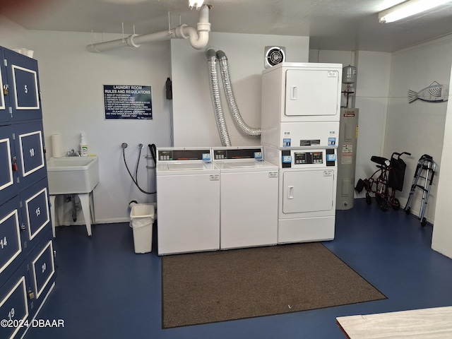 laundry room featuring water heater, stacked washing maching and dryer, and washing machine and clothes dryer