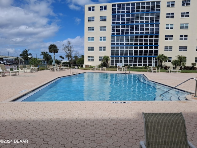 view of pool featuring a patio