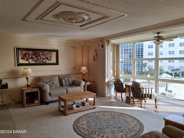 living room with a textured ceiling and ceiling fan