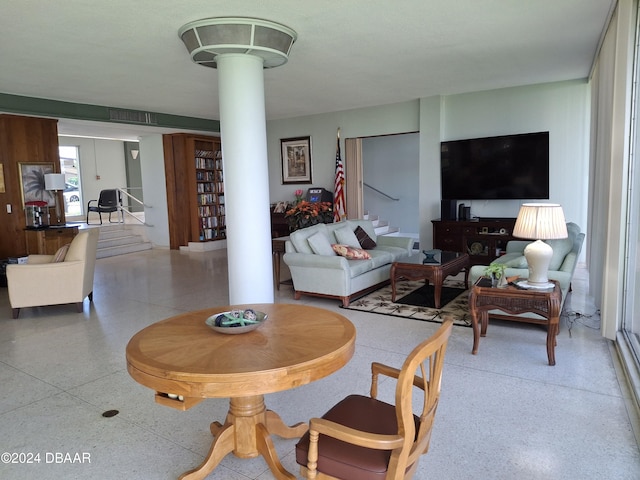 living room featuring ornate columns