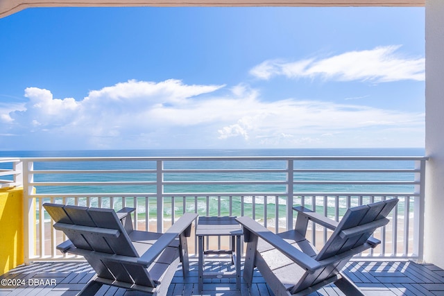 balcony with a view of the beach and a water view