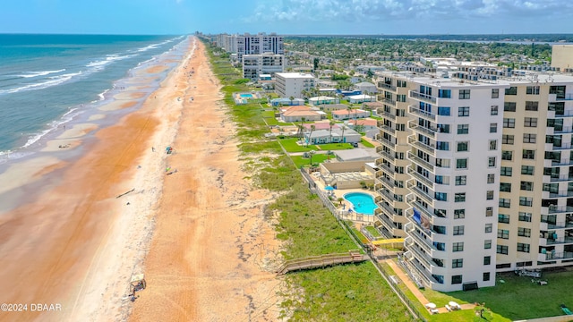 drone / aerial view featuring a view of the beach and a water view