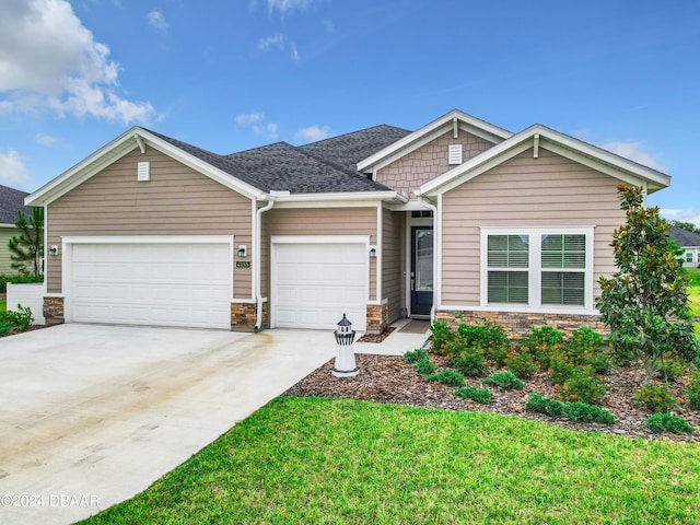 4155 Clifden Dr, Ormond Beach, FL 32174 - view of front of house with a front lawn and a garage
