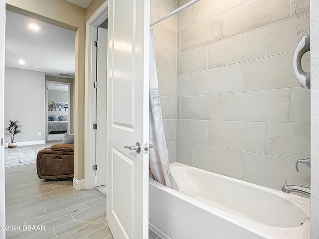 bathroom featuring shower / tub combo with curtain