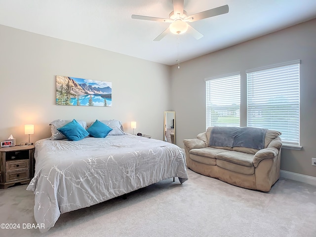 bedroom featuring ceiling fan and light colored carpet