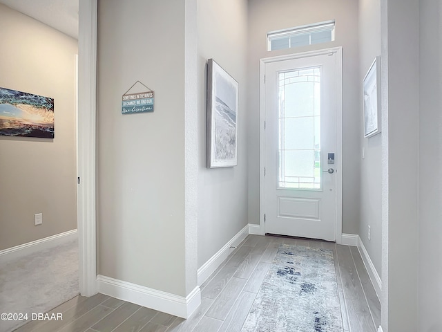 doorway with hardwood / wood-style floors