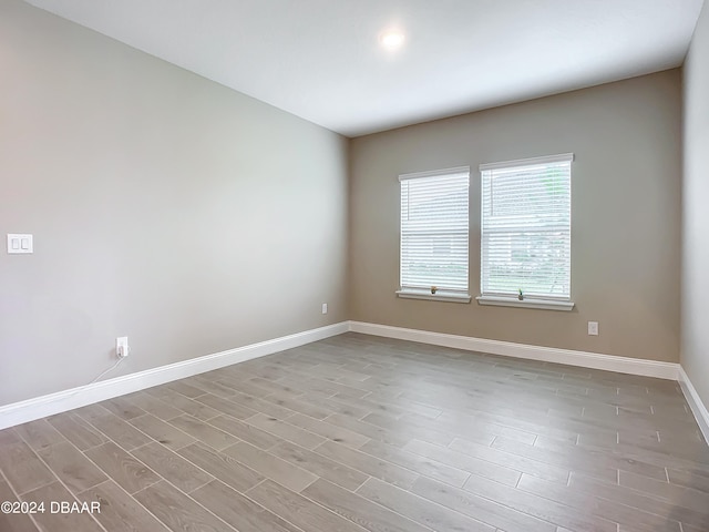 spare room featuring light hardwood / wood-style floors