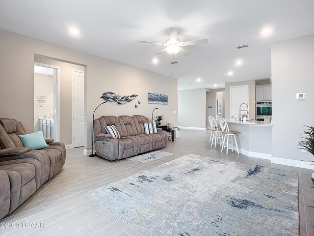 4155 Clifden Dr, Ormond Beach, FL 32174 - living room with light wood-type flooring and ceiling fan