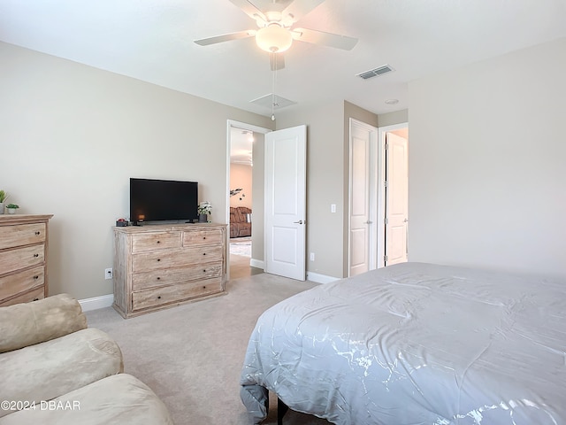 bedroom with light carpet and ceiling fan