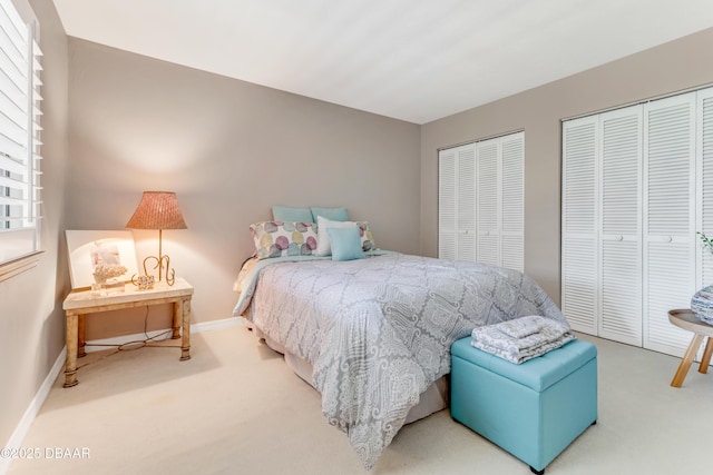 97 Oxbow Trl, Ormond Beach, FL 32174 - bedroom featuring carpet, multiple closets, and baseboards