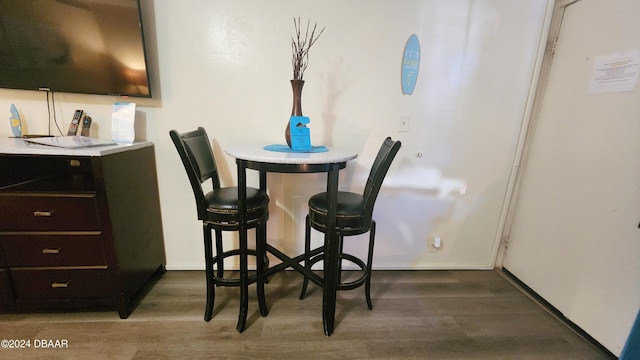 dining area featuring dark hardwood / wood-style flooring