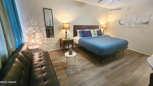 bedroom with wood-type flooring and ceiling fan