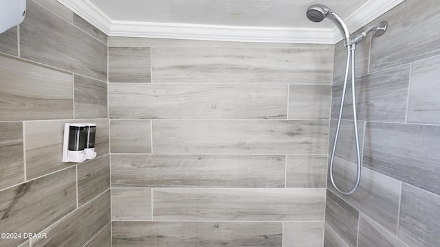 bathroom with tiled shower