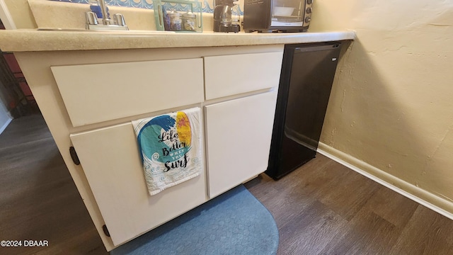 details featuring dishwasher and hardwood / wood-style flooring