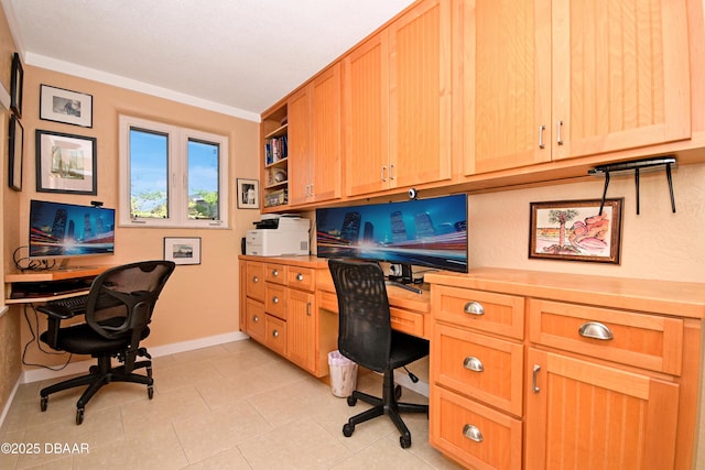 tiled office featuring built in desk and crown molding