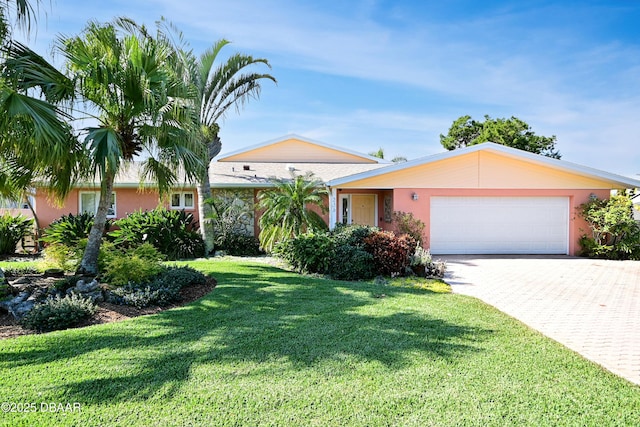 single story home with a front yard and a garage