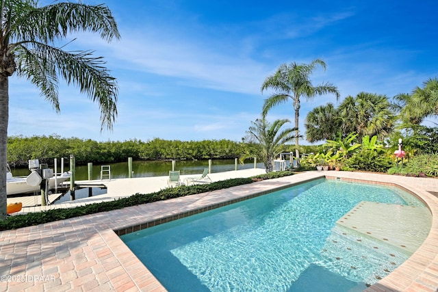 view of pool with a boat dock and a water view