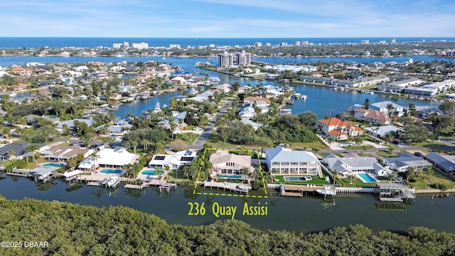 birds eye view of property with a water view