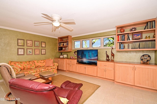 living room featuring ceiling fan and crown molding