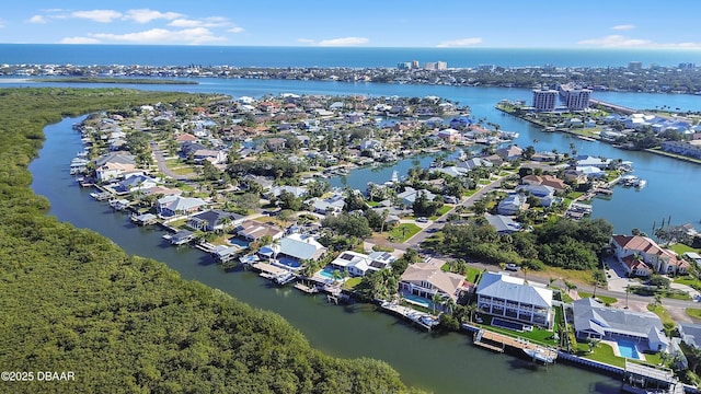 birds eye view of property featuring a water view