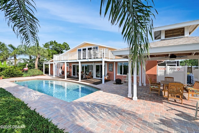 view of pool featuring a patio area and ceiling fan