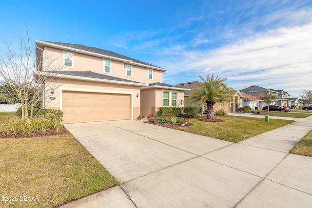 view of front of home with a garage and a front yard