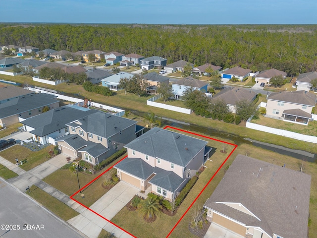 aerial view with a residential view and a view of trees