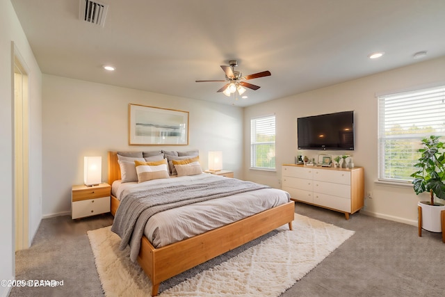 carpeted bedroom with visible vents, baseboards, and recessed lighting