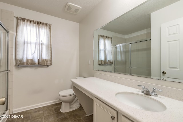 bathroom with a wealth of natural light, visible vents, and tiled shower