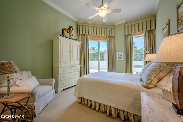 carpeted bedroom with access to exterior, ceiling fan, and ornamental molding