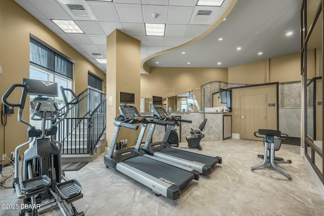 exercise room featuring a drop ceiling