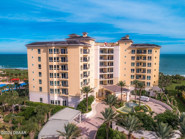 view of building exterior with a water view