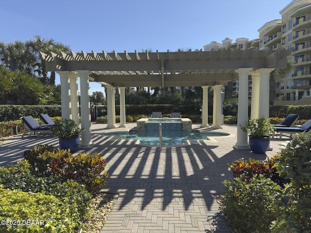 view of patio / terrace featuring a pergola, pool water feature, and a pool with hot tub