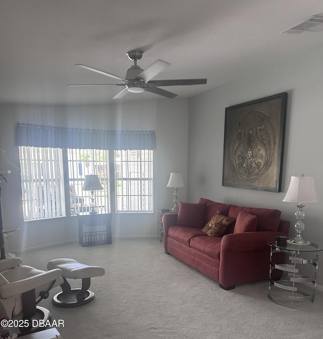 69 Turquoise Ave, Naples, FL 34114 - living room featuring carpet floors, plenty of natural light, ceiling fan, and baseboards