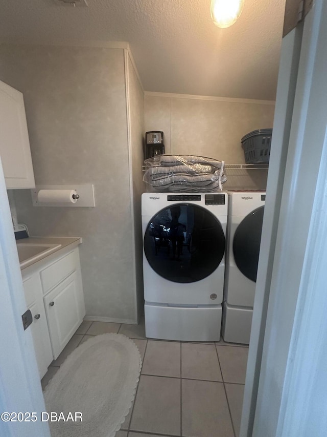69 Turquoise Ave, Naples, FL 34114 - laundry room with separate washer and dryer, light tile patterned flooring, cabinet space, a textured ceiling, and crown molding